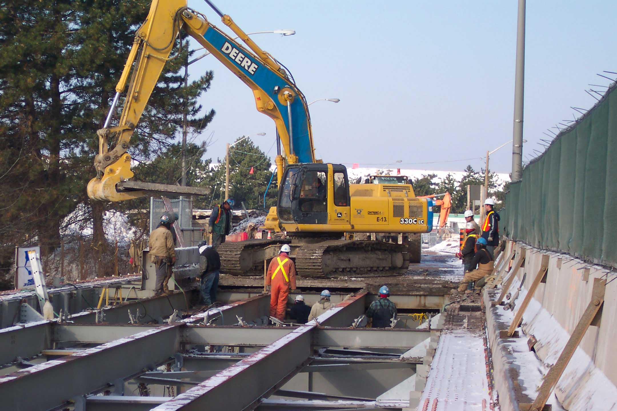 Removal of existing concrete bridge deck.